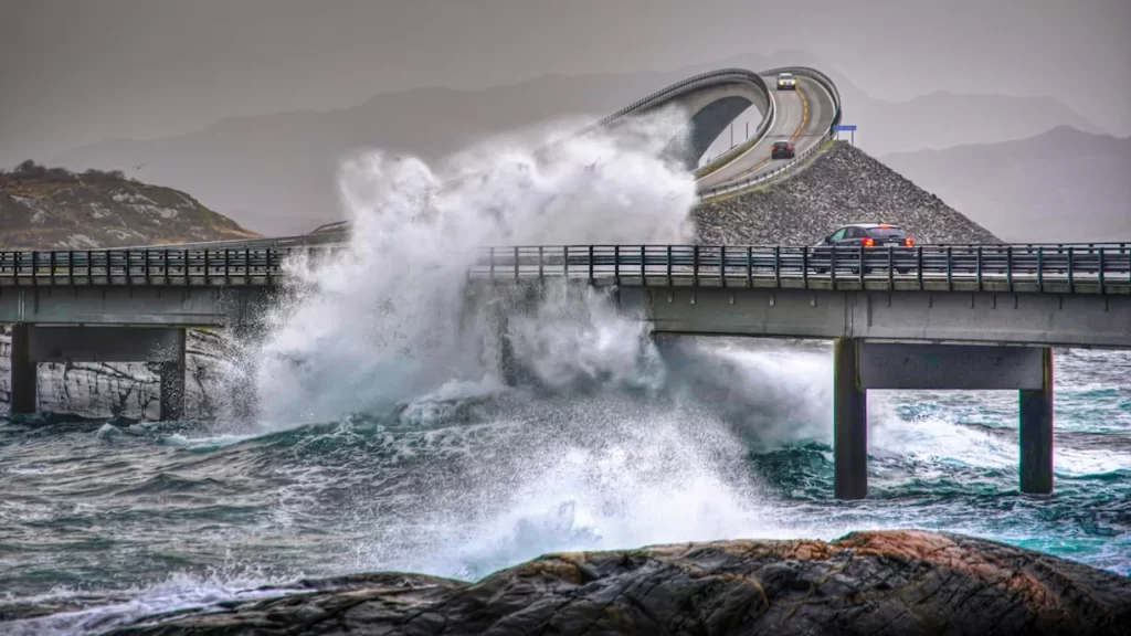 Waves crashing against bridges on Norway’s Atlantic Road during stormy weather