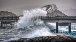 Waves crashing against bridges on Norway’s Atlantic Road during stormy weather